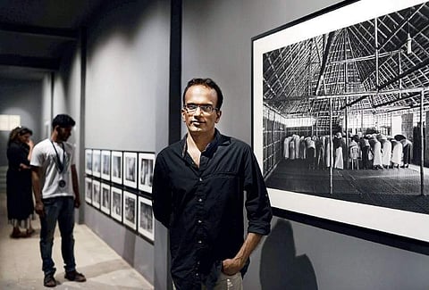 Artist K R Sunil at the ‘Vanishing worlds’ exhibition at Aspin Wall, Fort Kochi Express