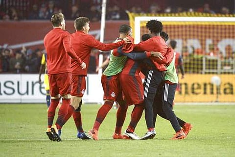 Toronto FC teammates celebrate following their 4-2 victory over the New York Red Bulls in an MLS soccer game. | AP