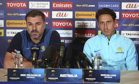 Australia's soccer head coach Ange Postecoglou, left, and player Mark Milligan discuss their pending Soccer World Cup qualifying match against Syria in Sydney, Australia, Monday, Oct. 9, 2017. | AP