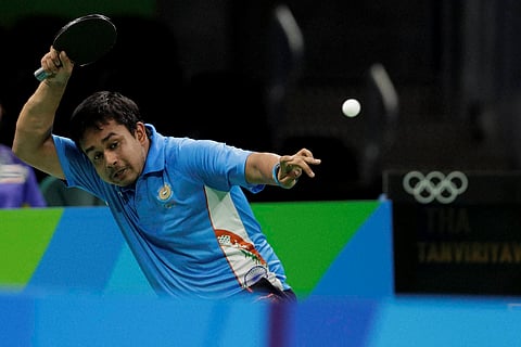 Soumyajit Ghosh of India competes against Padasak Tanviriyavechakul of Thailand during their men's table tennis match at the 2016 Summer Olympics in Rio de Janeiro Brazil Saturday Aug. 6 2016. | AP
