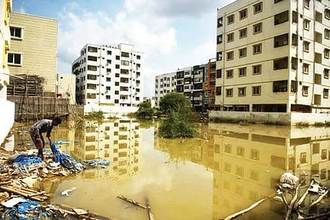 Bhandari layout waterlogged after Monday’s rain at Kukatpally in Hyderabad on Tuesday | Vinay Madapu
