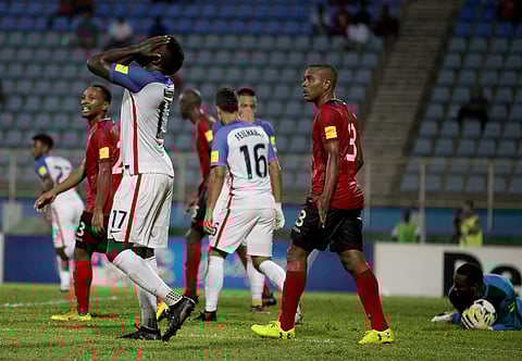 United States' Jozy Altidore, left, reacts after missing a chance to score during a 2018 World Cup qualifying soccer match against Trinidad and Tobago in Couva, Trinidad, Tuesday, Oct. 10, 2017. | AP