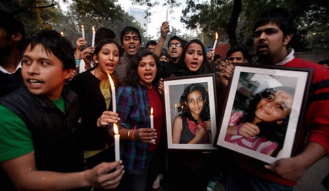 Students of Delhi University during a candlelight vigil for murdered teenager Aarushi in New Delhi. (File | PTI)