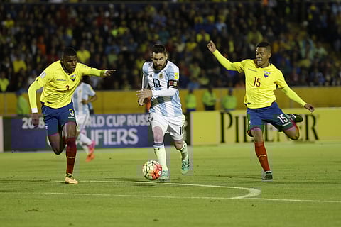 Argentina's Lionel Messi, center, fights for the ball against Ecuador's Robert Arboleda, left, and Ecuador's Jefferson Intriago during their 2018 World Cup qualifying soccer match at the Atahualpa Olympic Stadium in Quito, Ecuador, Tuesday, Oct. 10, 2017.
