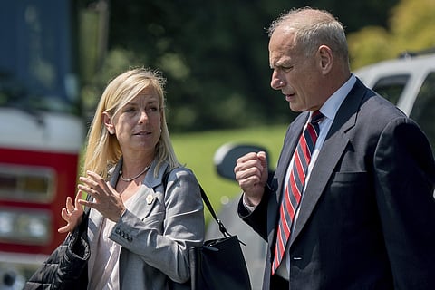 Newly nominated DHS chief Kirstjen Nielsen with her predecessor John Kelly (AP)