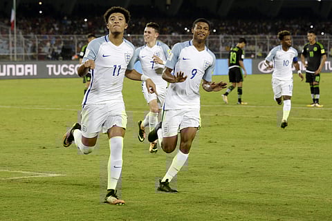 England's Jadon Sancho, Philip Foden, Rhian Brewster and Angel Gomes celebrate a goal against Mexico during the FIFA U-17 World Cup match in Kolkata, India, Wednesday, Oct. 11, 2017. | AP