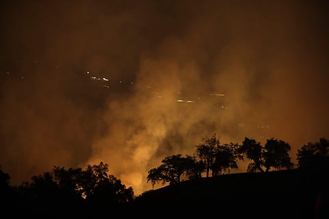 A wildfires creates an orange glow in a view from a hilltop Friday, Oct. 13, 2017, in Geyserville, Calif. | AP