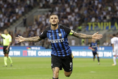 Inter Milan's Mauro Icardi celebrates after scoring during the Serie A soccer match between Inter Milan and Fiorentina at the San Siro stadium in Milan. | AP