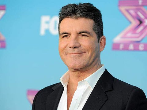 Simon Cowell asks dead parents for advice