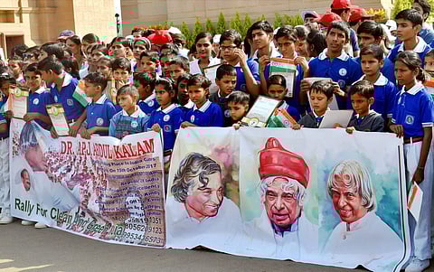 Students take part in a rally at a function organised to mark the 86th birthday anniversary of former president of India APJ Abdul Kalam in front of India Gate in New Delhi on Sunday. | PTI