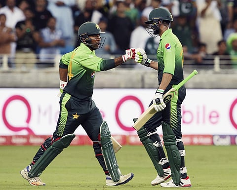 Pakistan's captain Sarfaraz Ahmed, left, replaces with Shoaib Malik after his dismissal during their first ODI cricket match against Sri Lanka in Dubai, United Arab Emirates, Friday, Oct. 13, 2017. | AP