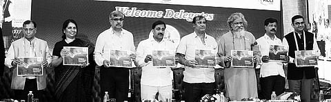 Tourism Minister Ashok Panda releasing coffee table book on tourism at Odisha Travel Bazaar in Bhubaneswar on Sunday | Express