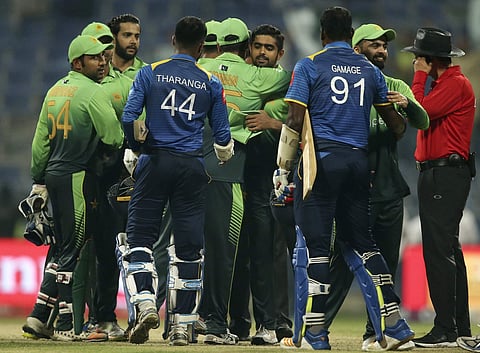 Pakistan players celebrate after they beat Sri Lanka in their second ODI cricket match in Abu Dhabi, United Arab Emirates, Monday, Oct. 16, 2017. | AP