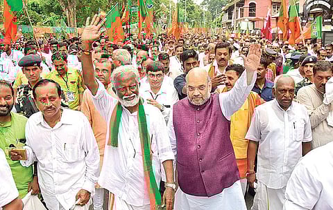 BJP national president Amit Shah with party state president Kummanam Rajasekharan at the University College Junction, Thiruvananthapuram, during the final leg of the Jana Raksha Yatra on Tuesday| B P Deepu