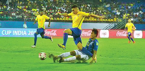 Brazil’s Paulinho skips past a challenge from Honduras’ Gustavo Vallecillo in their FIFA U-17 World Cup pre-quarterfinal at the Jawaharlal Nehru International Stadium in Kochi on Wednesday. Brazil won 3-0 to enter the quarterfinal | K Shijith