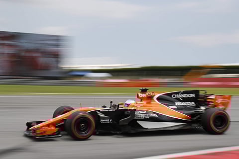 McLaren driver Fernando Alonso of Spain steers his car during the third practice for the Malaysian Formula One Grand Prix in Sepang, Malaysia, Saturday, Sept. 30, 2017. | AP
