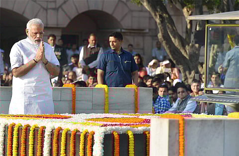 Prime Minister Narendra Modi paid tributes to Mahatma Gandhi the father of the nation on his 148th birth anniversary at Rajghat in New Delhi on Monday. | PTI