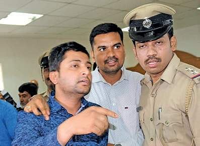Irfan Pasha (left) posed as a senior police officer to make easy money