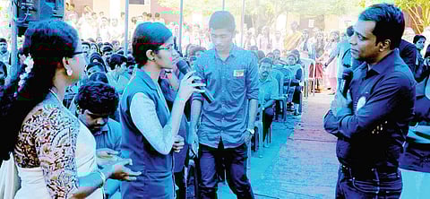 Irfan Alam intracts with students at the Government Higher Secondary School at Karimba in Palakkad district.