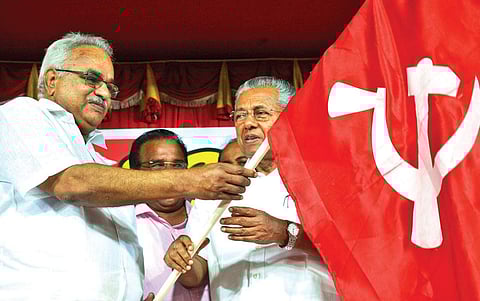 Kerala CM Pinarayi Vijayan handing over the party flag to CPI state secretary Kanam Rajendran at the inauguration of Jana Jagratha Yatra by LDF in Thiruvananthapuram