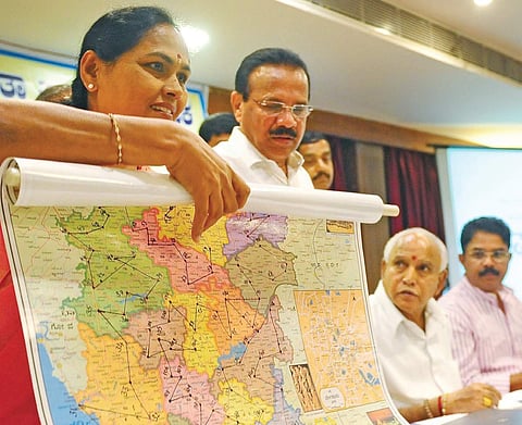 BJP MP Shobha Karandlaje releasing BJP Parivartana Yatra route map in Bengaluru on Monday. Union Minister D V Sadananda Gowda, party leaders B S Yeddyurappa and R Ashok look on | NAGESH POLALI