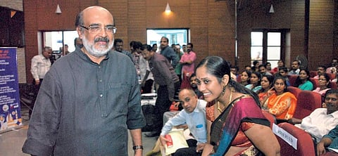 Finance Minister T M Thomas Isaac walks to the dais to address the KSFE's meeting at the Town Hall, Ernakulam on Monday. (EPS | K Shijith)