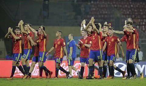 Spain's soccer players celebrate their victory over Mali during their FIFA U-17 World Cup semifinal match in Mumbai.