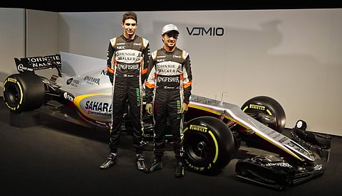 Force India driver Sergio Perez of Mexico, right, and Force India driver Esteban Ocon of France pose at the launch of the new Force India F1 car, VJM10. | AP