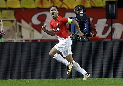 Monaco's Radamel Falcao celebrates scoring the opening goal during the Champions League Group G first leg soccer match between Monaco and Besiktas at Louis II stadium in Monaco, Tuesday, Oct. 17, 2017. | AP