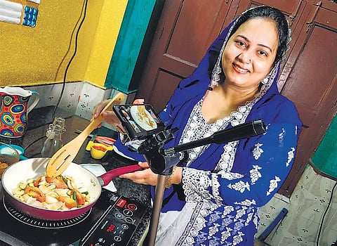 An Internet-challenged scrap dealer’s wife has empowered herself and her family through her exotic recipes on YouTube