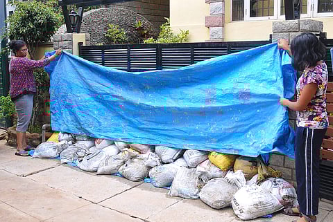 HSR Layout resident Meena Gupta at her residence where rainwater had entered following heavy rains in Benglauru. (EPS | Pushkar V)