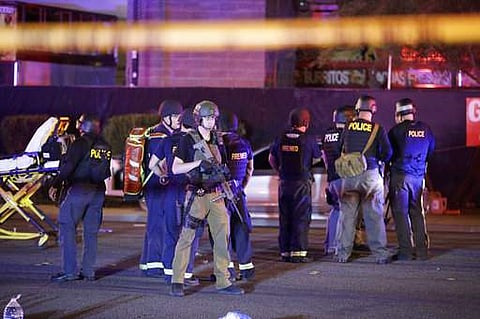 Police officers and medical personnel near the site of the shooting - the Mandalay Bay resort and casino on the Las Vegas Strip. (AP Photo)