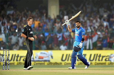 Indian batsman Virat Kohli celebrates his century during third ODI against New Zealand at Green Park Stadium in Kanpur on Sunday. | PTI