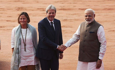 Italian Prime Minister Paolo Gentiloni shakes hands with Prime Minister Narendra Modi as he arrives for a ceremonial reception at the President's House in New Delhi on Monday. (Express photo | Shekhar Yadav)