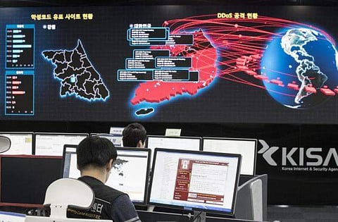 In this Monday, May 15, 2017, file photo, employees watch electronic boards to monitor possible ransomware cyberattacks at the Korea Internet and Security Agency in Seoul, South Korea. (Photo | Associated Press)