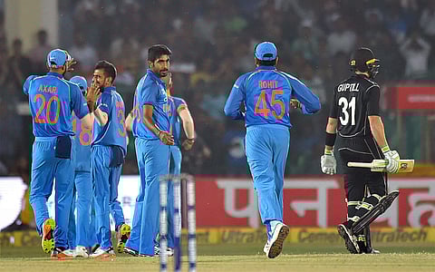 India's Jasprit Bumrah celebrates the wicket of New Zealand batsman Martin Guptill. Required to defend 15 runs in the final over, 'King of Death' Bumrah (3/47 in 10 overs) delivered yet again and conceded only eight runs in the 50th over. | PTI