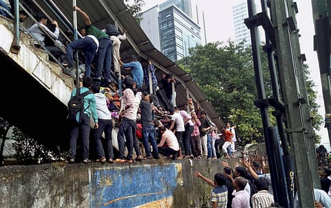 A photograph of the stampede at Elphinstone railway station's foot over bridge in Mumbai | PTI