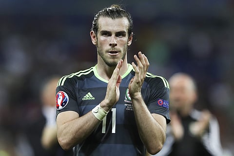 In this Wednesday, July 6, 2016 file photo, Wales's Gareth Bale acknowledges the fans at the end of their Euro 2016 semifinal soccer match against Portugal. | AP