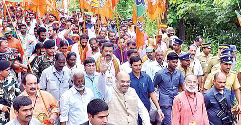 BJP national chief Amit Shah walking with Kummanam Rajasekharan, state party chief, and others from Payyannur to Pilathara on Tuesday. Suresh Gopi, Alphons Kannanthanam, C K Padmanabhan and V Muraleedharan are also seen