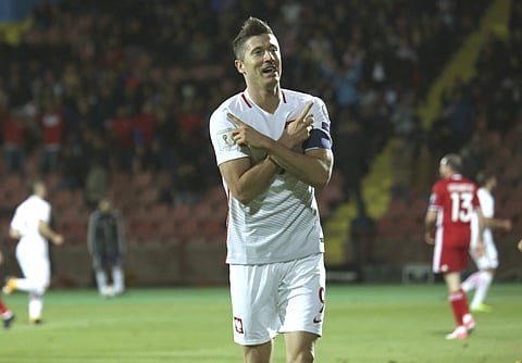 Poland's Robert Lewandowski celebrates scoring his goal during the World Cup Group E qualifying soccer match between Armenia and Poland in Yerevan, Armenia, Thursday, Oct. 5, 2017. | AP