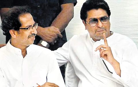 MNS chief Raj Thackeray with his cousin Uddhav Thackeray (left)