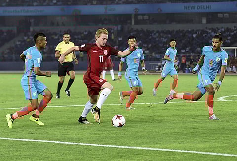 Players of India and USA vie for the ball during their U-17 FIFA World Cup football match in New Delhi on Friday. | PTI