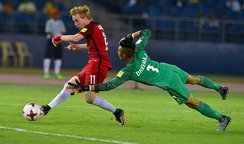 Indian goalkeeper Dheeraj fails to save as USA's Carleton scores the 3rd goal against India during their U-17 FIFA World cup match against USA in New Delhi on Friday. | PTI