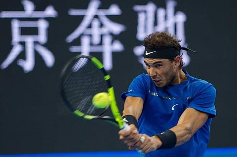 Rafael Nadal of Spain hits a return during his men's singles final match against Nick Kyrgios. (Photo | AP)