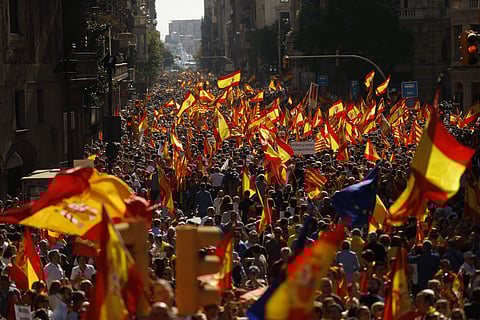 Thousands of people march to protest the Catalan government's push for secession from the rest of Spain in downtown Barcelona.(Photo | AP)