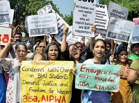 Members of AISA, AIDWA and KYS display placards and shout slogans against Uttar Pradesh Chief Minister Yogi Adityanath during a protest in support of Banaras Hindu University BHU girls' agitation at Jantar Mantar in New Delhi on Monday. (Photo | PTI)