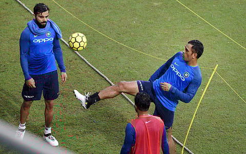 Skipper Virat Kohli and Mahendra Singh Dhoni playing football during a practice session at ACA Stadium in Guwahati on Monday ahead of 2nd T-20 match against Australia.|PTI