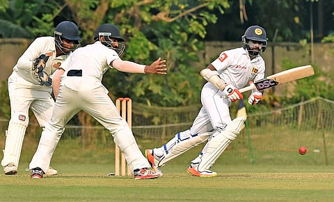Sri Lanka batsman Niroshan Dickwella plays a shot during the warm-up match against Board President XI at Jadavpur University stadium 2nd campus at Salt Lake in Kolkata.|PTI