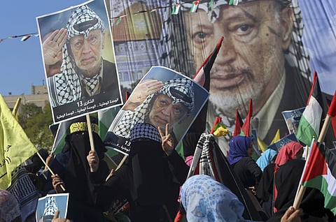 Palestinians gather on the main square to mark the 13th anniversary of his death, in Gaza City. | AP