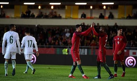 Portugal's midfielder Goncalo Guedes (C) celebrates with teammates after scoring a goal during the international friendly football match Portugal against Saudi Arabia at the Fontelo stadium in Viseu on November 10, 2017. | AFP